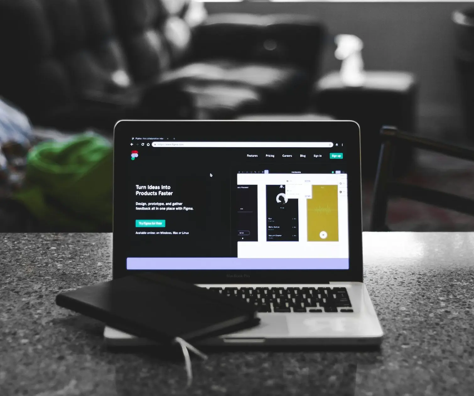 focus photo of black and white laptop computer turned on